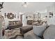 Expansive living room with stylish decor, recessed lighting, and comfortable couches at 10780 W Woodland Ave, Avondale, AZ 85323