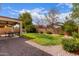 Lush backyard with a covered patio and well-maintained landscaping at 11106 E Serafina Ave, Mesa, AZ 85212