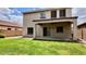 Expansive backyard with lush grass and a covered patio for outdoor relaxation at 11106 E Serafina Ave, Mesa, AZ 85212