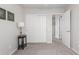 Bright bedroom with neutral walls, plush carpeting, closet space, and natural light for a welcoming space at 11106 E Serafina Ave, Mesa, AZ 85212