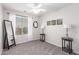 Light-filled bedroom featuring a large window, soft carpeting, and versatile furniture for a cozy ambiance at 11106 E Serafina Ave, Mesa, AZ 85212