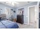 Well-lit themed bedroom featuring a blue color scheme, dresser, and comfortable bed, designed for fun and relaxation at 11106 E Serafina Ave, Mesa, AZ 85212