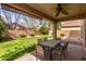 Inviting covered patio with ceiling fan, ideal for outdoor dining and relaxation at 11106 E Serafina Ave, Mesa, AZ 85212