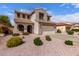 Inviting two-story home featuring a neutral stucco facade, tiled roof, and well-maintained desert landscaping at 11106 E Serafina Ave, Mesa, AZ 85212