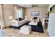 Bright living room with neutral colors, modern furniture and a ceiling fan at 11106 E Serafina Ave, Mesa, AZ 85212