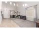 Spacious living room with soaring ceilings, neutral colors, and an abundance of natural light at 11106 E Serafina Ave, Mesa, AZ 85212