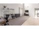 Bright living room with gray decor, providing an airy and comfortable living space at 11106 E Serafina Ave, Mesa, AZ 85212
