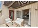 Relaxing outdoor patio featuring comfortable seating, a decorative pergola, and convenient access to the living area at 11260 N 92Nd St # 2025, Scottsdale, AZ 85260
