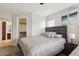 Bedroom featuring one of two beds, carpet, and a view into the closet on the adjacent wall at 11260 N 92Nd St # 2025, Scottsdale, AZ 85260