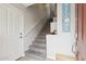 Inviting entryway with neutral tones, tile flooring, and a staircase leading to the upper level at 11260 N 92Nd St # 2025, Scottsdale, AZ 85260