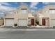Exterior view of townhome featuring private garages, private entrances, and desert landscaping at 11260 N 92Nd St # 2025, Scottsdale, AZ 85260
