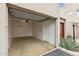 Spacious garage with ample storage and a door leading to the exterior of the house at 11260 N 92Nd St # 2025, Scottsdale, AZ 85260