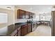 This kitchen has dark wood cabinets, stainless steel appliances, and a breakfast bar at 11260 N 92Nd St # 2025, Scottsdale, AZ 85260
