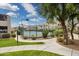 Community tennis court surrounded by lush landscaping and a paved walkway at 11260 N 92Nd St # 2025, Scottsdale, AZ 85260