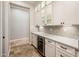Convenient bar area features a wine refrigerator and attractive glass shelving at 13221 W Rincon Dr, Sun City West, AZ 85375