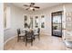 Bright breakfast nook features a glass-top table and views to the exterior at 13221 W Rincon Dr, Sun City West, AZ 85375