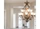Ornate dining room chandelier with crystal pendants and multiple lights at 13221 W Rincon Dr, Sun City West, AZ 85375