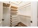 Organized closet with adjustable shelving, drawers, and a clothing rod for optimal storage at 13221 W Rincon Dr, Sun City West, AZ 85375
