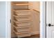 Well-organized closet with pull-out mesh baskets and adjustable shelving maximizes storage efficiency at 13221 W Rincon Dr, Sun City West, AZ 85375
