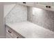 Detailed view of the granite countertop with white cabinets and black hardware, showcasing an elegant design at 13221 W Rincon Dr, Sun City West, AZ 85375