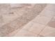 Detailed tile flooring features accent mosaic insert and neutral color palette at 13221 W Rincon Dr, Sun City West, AZ 85375