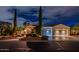 Inviting home featuring a circular driveway, three-car garage, and lush landscaping at 13221 W Rincon Dr, Sun City West, AZ 85375