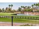 Scenic view of the community golf course with water feature and lush landscaping from the property at 13221 W Rincon Dr, Sun City West, AZ 85375