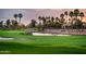 A beautiful golf course view shows the well-manicured green and manicured landscaping at 13221 W Rincon Dr, Sun City West, AZ 85375