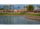 This home on the golf course has water features and mature palm trees at 13221 W Rincon Dr, Sun City West, AZ 85375