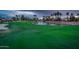 Expansive golf course view with a tranquil pond, fountain, and lush green fairway at 13221 W Rincon Dr, Sun City West, AZ 85375