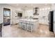 Spacious kitchen features a large central island with seating and white cabinetry at 13221 W Rincon Dr, Sun City West, AZ 85375