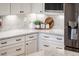 Kitchen corner with stainless steel refrigerator and granite countertops at 13221 W Rincon Dr, Sun City West, AZ 85375