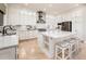 Stylish kitchen features a large island, stainless appliances and tile flooring at 13221 W Rincon Dr, Sun City West, AZ 85375