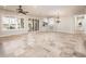 Bright living area with large windows and transition to the kitchen at 13221 W Rincon Dr, Sun City West, AZ 85375
