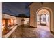 Covered outdoor patio with a charming fireplace, horse sculpture, and artistic deer statue at 13221 W Rincon Dr, Sun City West, AZ 85375