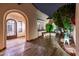 Charming outdoor patio with a wrought-iron table set and artistic deer statue at 13221 W Rincon Dr, Sun City West, AZ 85375