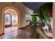 Charming outdoor patio with a wrought-iron table set and artistic deer statue at 13221 W Rincon Dr, Sun City West, AZ 85375