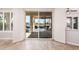 Sliding glass doors offer a view of the patio with a view of the pool and landscaped backyard at 13221 W Rincon Dr, Sun City West, AZ 85375
