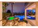 A beautiful pool and spa surrounded by natural rocks and stone steps leading into the hot tub at 13221 W Rincon Dr, Sun City West, AZ 85375