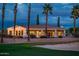 Exterior of the home backed by the green fairways of the manicured golf course at 13221 W Rincon Dr, Sun City West, AZ 85375