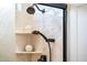 Contemporary shower with dual showerheads and stylish shelves adds a spa-like feel to the bathroom at 13221 W Rincon Dr, Sun City West, AZ 85375