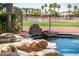 Backyard pool with spa and views of the community golf course at 13221 W Rincon Dr, Sun City West, AZ 85375