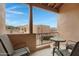 Balcony seating area with metal table and chairs and views of the surrounding property at 13227 N Mimosa Dr # 107, Fountain Hills, AZ 85268