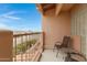 Balcony seating with terracotta tile, view of the neighborhood and mountains in the distance at 13227 N Mimosa Dr # 107, Fountain Hills, AZ 85268