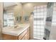 Bright bathroom with a vanity, ample counter space and unique glass block window at 13227 N Mimosa Dr # 107, Fountain Hills, AZ 85268