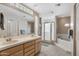 Bright bathroom with double sinks, spacious vanity, and separate tub and shower at 13227 N Mimosa Dr # 107, Fountain Hills, AZ 85268