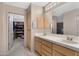 Bathroom features double sinks, vanity storage, and adjacent walk-in closet at 13227 N Mimosa Dr # 107, Fountain Hills, AZ 85268