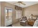 Bedroom seating area featuring a large window and door for ample natural light and views at 13227 N Mimosa Dr # 107, Fountain Hills, AZ 85268