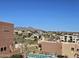 Community view featuring architecture, a swimming pool, and desert landscaping, set against a backdrop of mountains at 13227 N Mimosa Dr # 107, Fountain Hills, AZ 85268