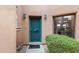 Front door with an ornate security door, desert plants, and window at 13227 N Mimosa Dr # 107, Fountain Hills, AZ 85268
